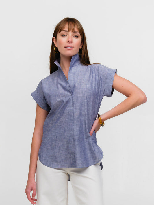 Woman wearing a luxury denim cap sleeve shirt